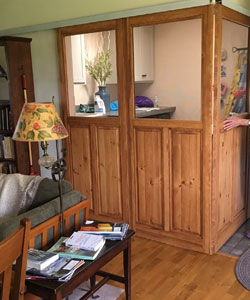 Model 3670 in Pine, Stained #221 with a Taller Bottom Panel. Used to create a room divider.